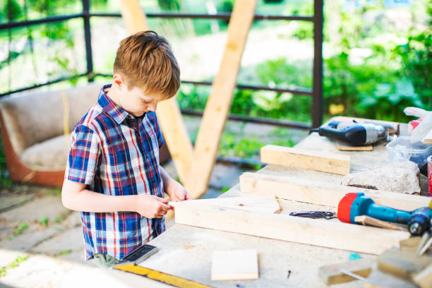 istock Father and son building tree house at backyard 1254285758
