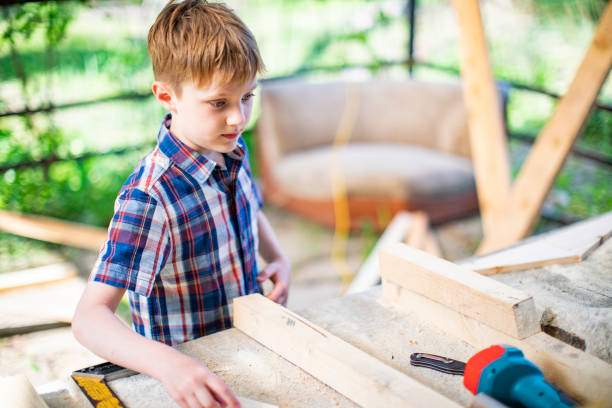 istock Father and son building tree house at backyard 1254285791