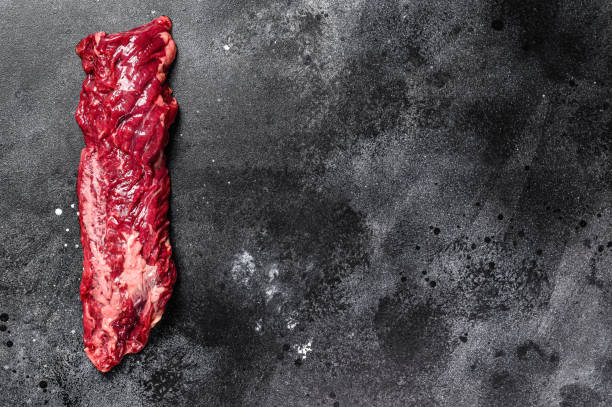 istock Raw top blade, Denver steak. Black background. Top view. Copy space 1254287066