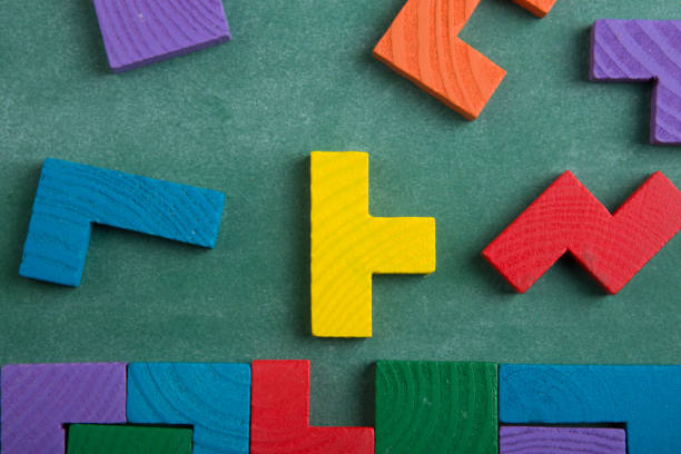 istock Creative solution for idea - business concept, jigsaw puzzle on the blackboard 1254289297