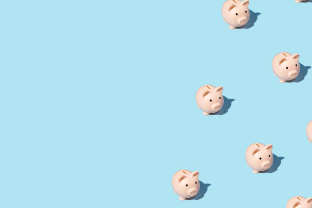 istock piggy bank izometric pattern on bright light blue background. Minimal flat lay texture. Abstract trendy fresh concept 1254289459