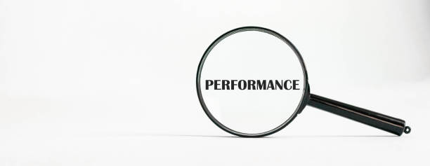 istock Magnifier with the word performance text concept on a light background 1254293739