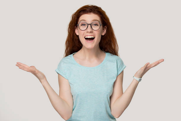 istock Overjoyed young red-haired woman feeling happiness. 1254296717