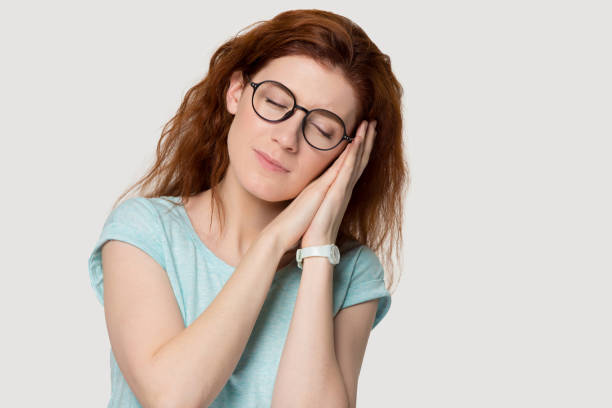 istock Attractive millennial calm folded hands near ears. 1254296723