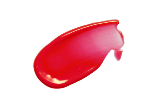 Red lip gloss swatch Red liquid lipstick swatch smear smudge isolated on white background. Shiny lip gloss stroke swipe. Makeup texture. Cosmetic product macrophotography makeup swipes stock pictures, royalty-free photos & images