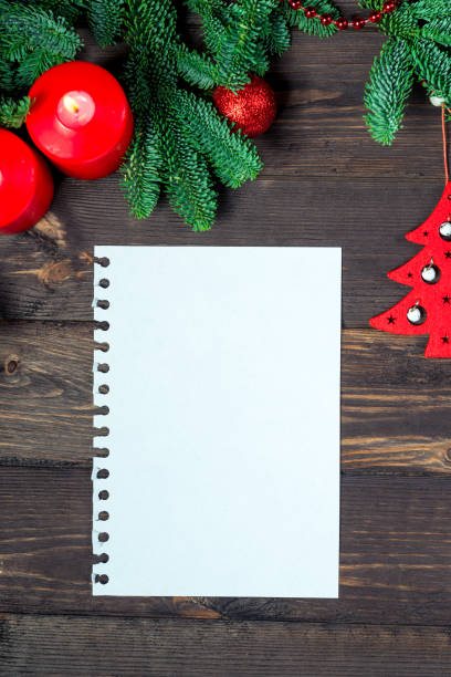 istock Vertical Notebook for writing greetings, New Year decorations top view greeting card closeup 1254301992