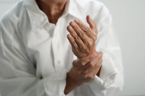 istock Elderly woman suffering from pain From Rheumatoid Arthritis 1254309336