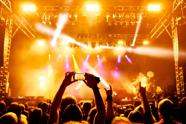 istock cheering people at rock concert 1254310223