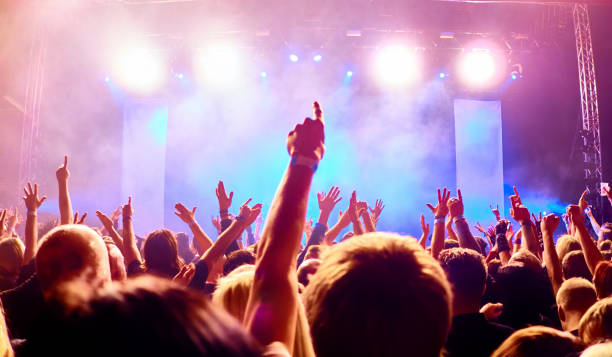 istock cheering people at rock concert 1254310331