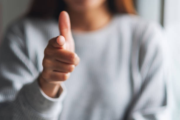 istock a woman pointing finger at you 1254317221