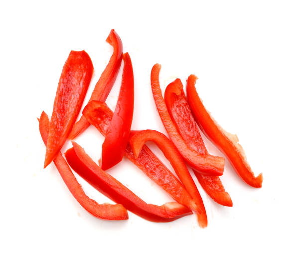 istock Red sweet bell pepper slices isolated on white background cutout 1254317963