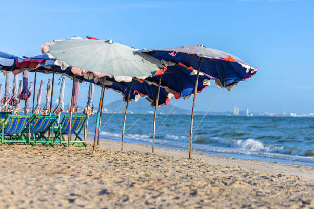 istock Beach chair under the umbrella on the beach. 1254318928