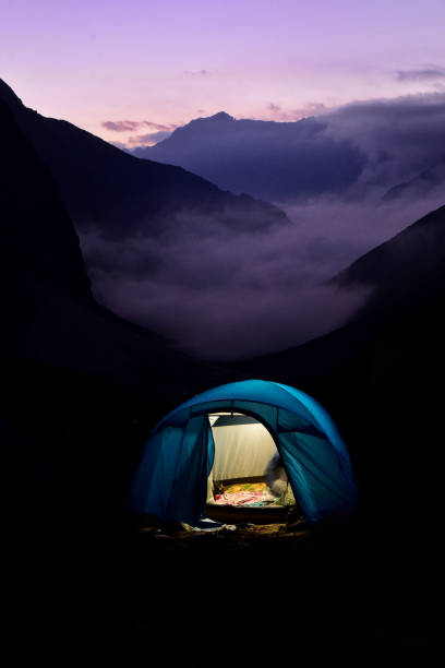 The purple evening. Hampta Pass, Manali, Himachal Pradesh, India - September 24, 2019 : Just after the sunset, when the sky burst in beautiful colours and clouds covering the whole valley. himachal pradesh photos stock pictures, royalty-free photos & images