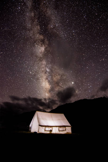 Our billion star home in himalayas. Korzok, Ladakh, India - August 19, 2019 : Milkyway rise over our tent. lahaul and spiti district photos stock pictures, royalty-free photos & images