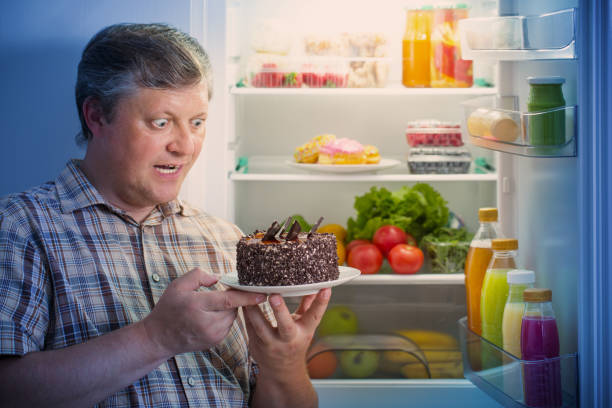 istock mature men at fridge  with food 1254330947