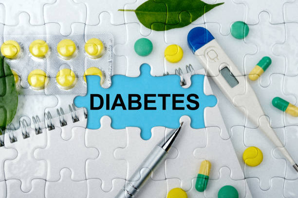 double exposure. puzzles with the image of tablets, a notebook, a thermometer and a pen with the inscription -diabetes - vitamin pill vitamin e isolated text imagens e fotografias de stock