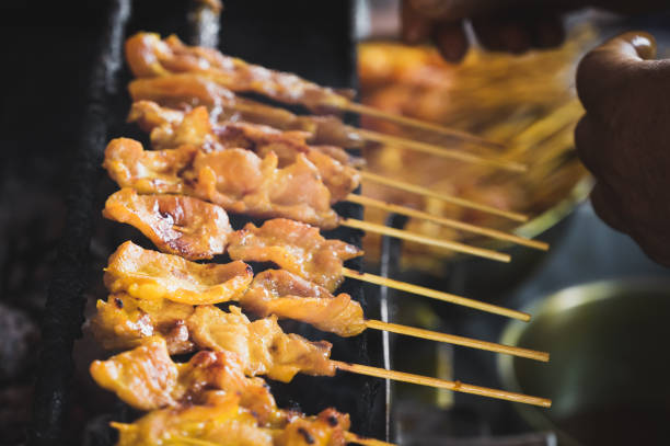 istock Grilling pork satay on a charcoal stove 1254336669