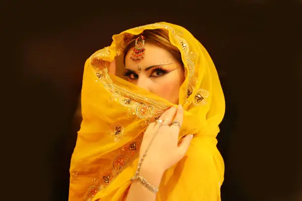 Indian Woman Portrait, Fashion Model in Yellow Sari Dress obscured face