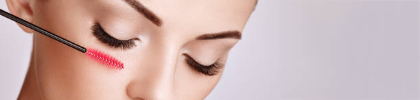 istock Beautiful woman with long false eyelashes 1254343574