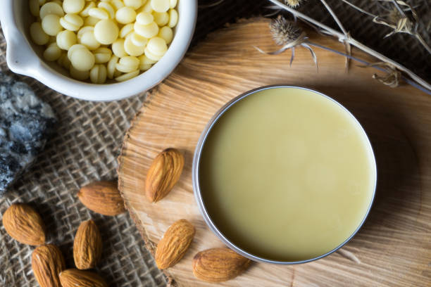 istock cocoa butter in granules and almonds on wood 1254343656