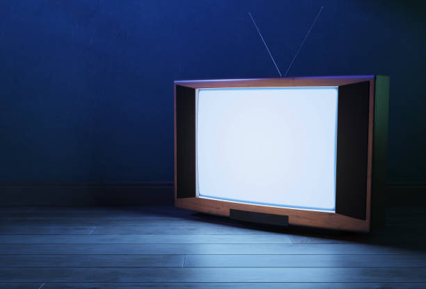 istock Glowing old TV screen. Old television on a dark background. 1254345406