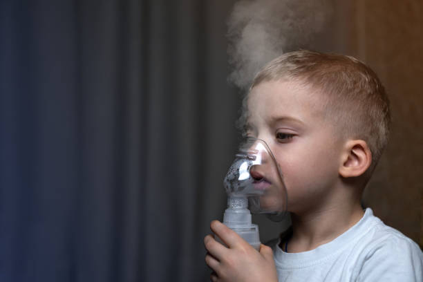 Inhalation child infant under five year. Boy making inhalation with nebulizer at home child health bronchiole stock pictures, royalty-free photos & images