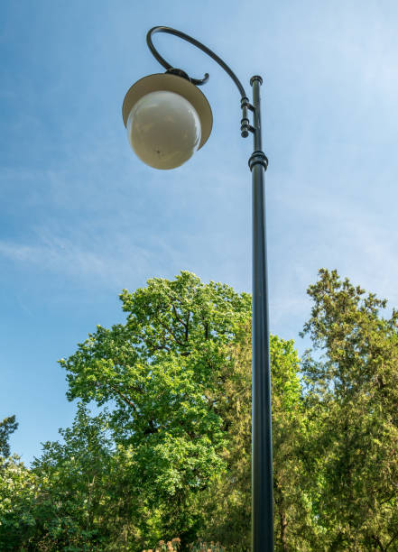 istock Street lamp or lamp post against blue sky. 1254345827