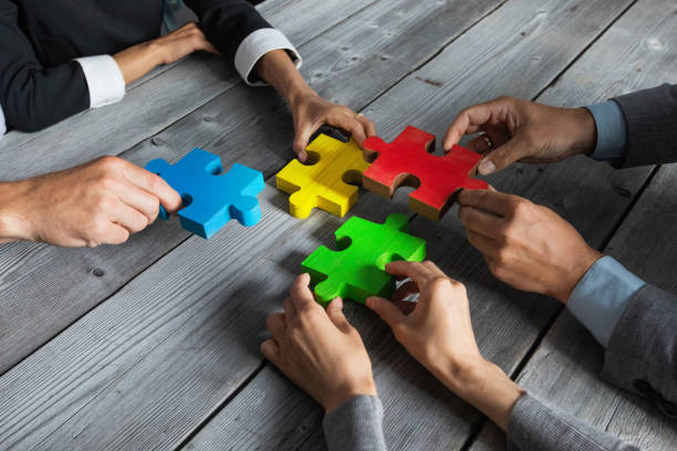 istock Business people and puzzle pieces 1254347551