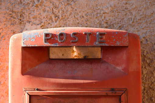 Rusty red postbox. Italian postbox
