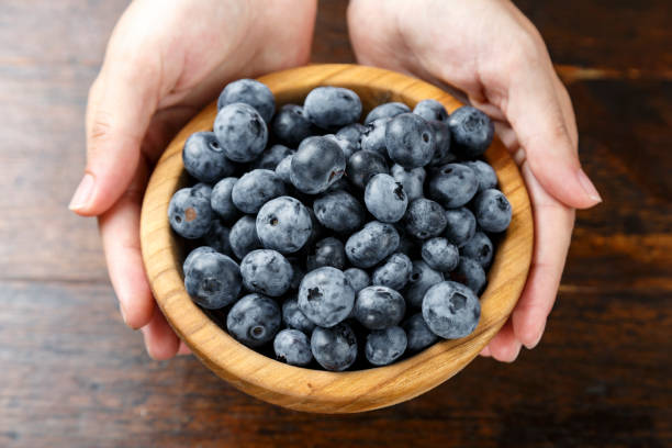 istock Blueberry in a wooden bowl 1254350295