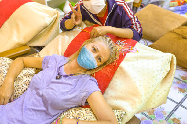 istock hairstylist with surgical mask 1254350325