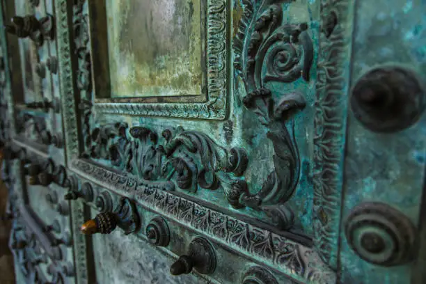 Copper Door of the Basilica di San Giovanni in Laterano in Rome, Italy. Close-up fragment