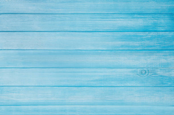 istock Blue painted pastel wood planks background with visible texture 1254351320