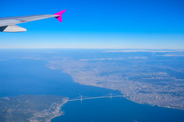 istock Bridge over the sea as seen from the airplane window 1254353053