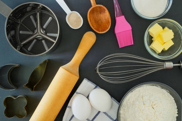 istock Close-up ingredients for baking and kitchen utensils on a black background 1254356067