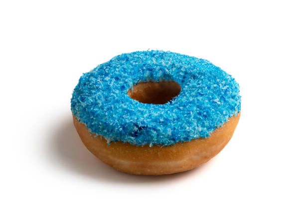 istock Donut decorated with blue cape. Isolated on white background 1254358593