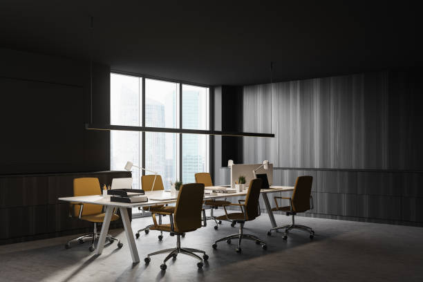 istock Dark wooden open space office corner 1254363709