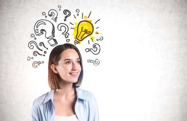 istock Smiling young woman and her good idea 1254364379