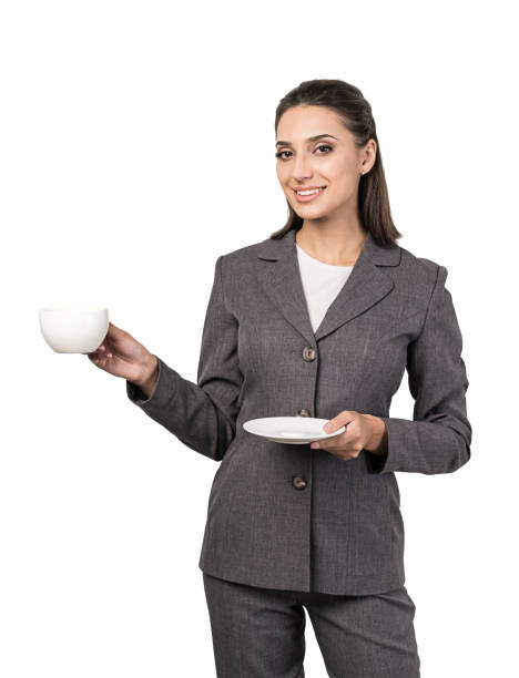istock Smiling businesswoman drinking coffee, isolated 1254364691
