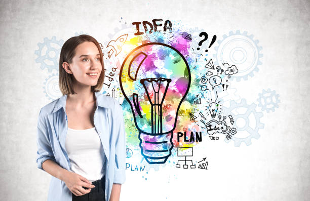 istock Smiling young woman, bright business idea 1254364916