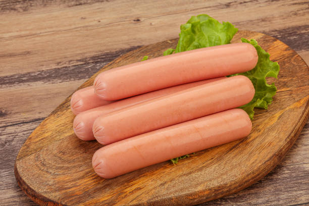 istock Tasty meat sausages over board 1254366151