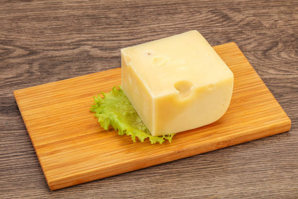 istock Emmental cheese over wooden board 1254366349