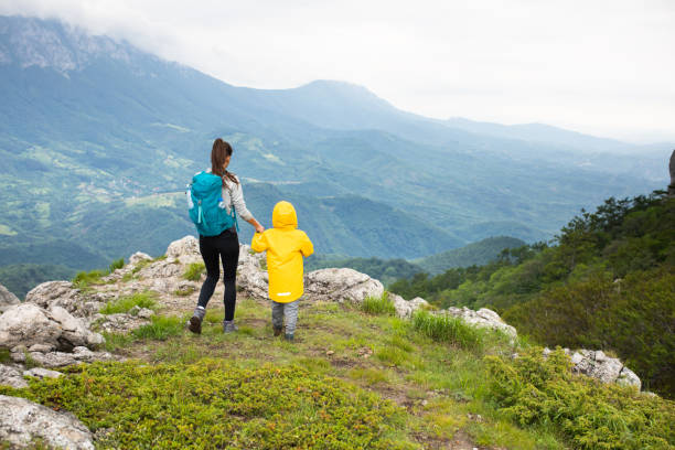 istock A boy and his mom holding hands while hiking 1254366731