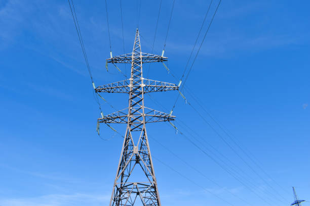 istock High-voltage power line against a clear blue sky 1254366945