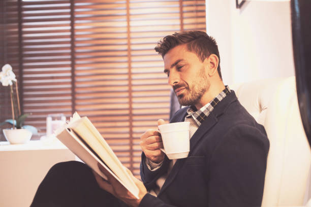 istock Relaxing at home and reading a book over weekend 1254371863