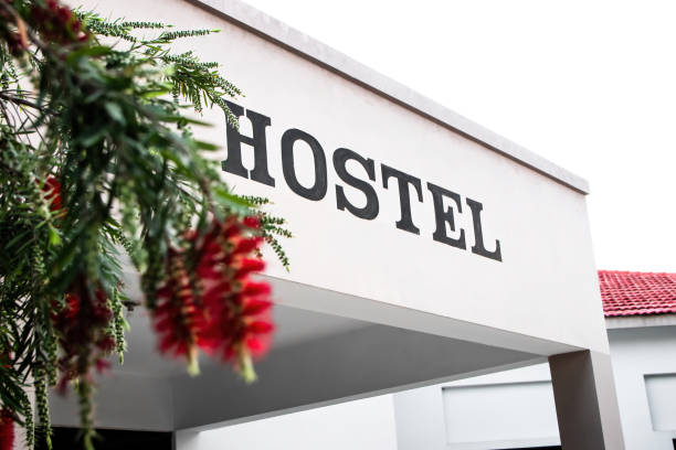 A building with hostel sign. Good place for college life students Hostel building for students. Young people spend memorable time in hostel life. hostel photos stock pictures, royalty-free photos & images