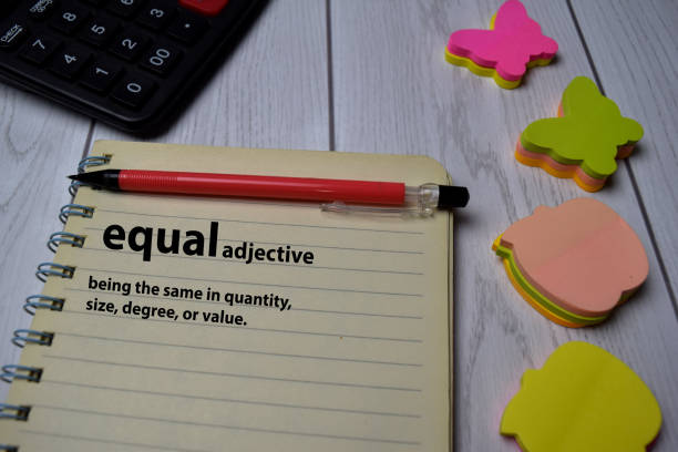 istock Definition of Equal word with a meaning on a book. dictionary concept 1254375302