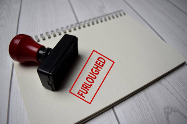 istock Red Handle Rubber Stamper and Furloughed text isolated on White Background. 1254375303