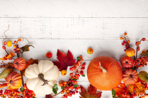 istock Festive autumn decor from pumpkins, berries and leaves 1254380192