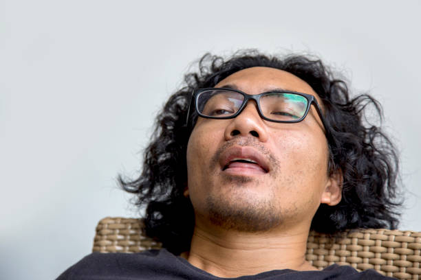 istock asian man face action on white 1254387125